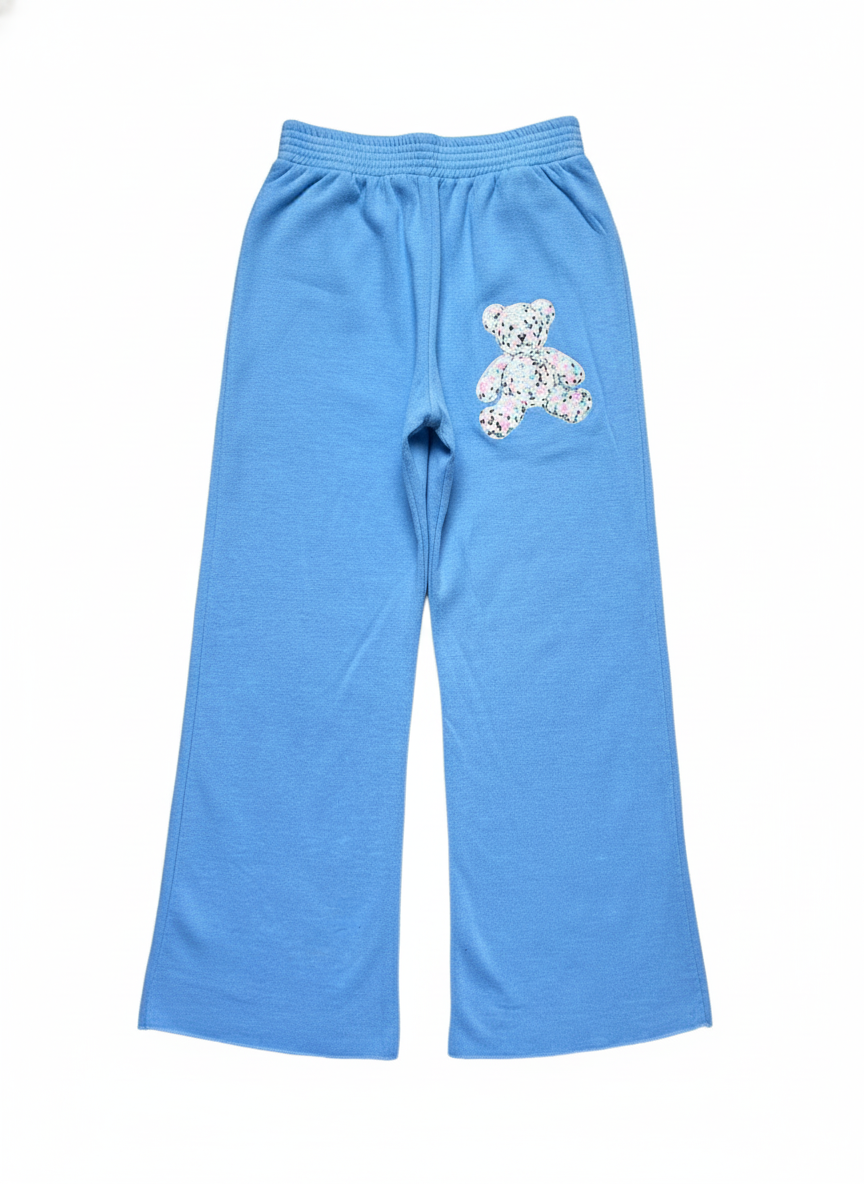 Blue pants with a teddy bear design on a white background