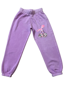 Purple children's sweatpants with a bow design on a white background