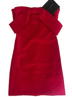 Red dress with a bow detail on a white background