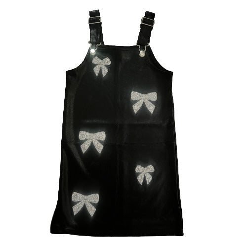 Black dress with silver bow patterns on a white background